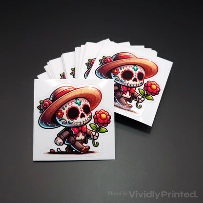 Individual kiss-cut skull stickers with a hat and flowers on white backing