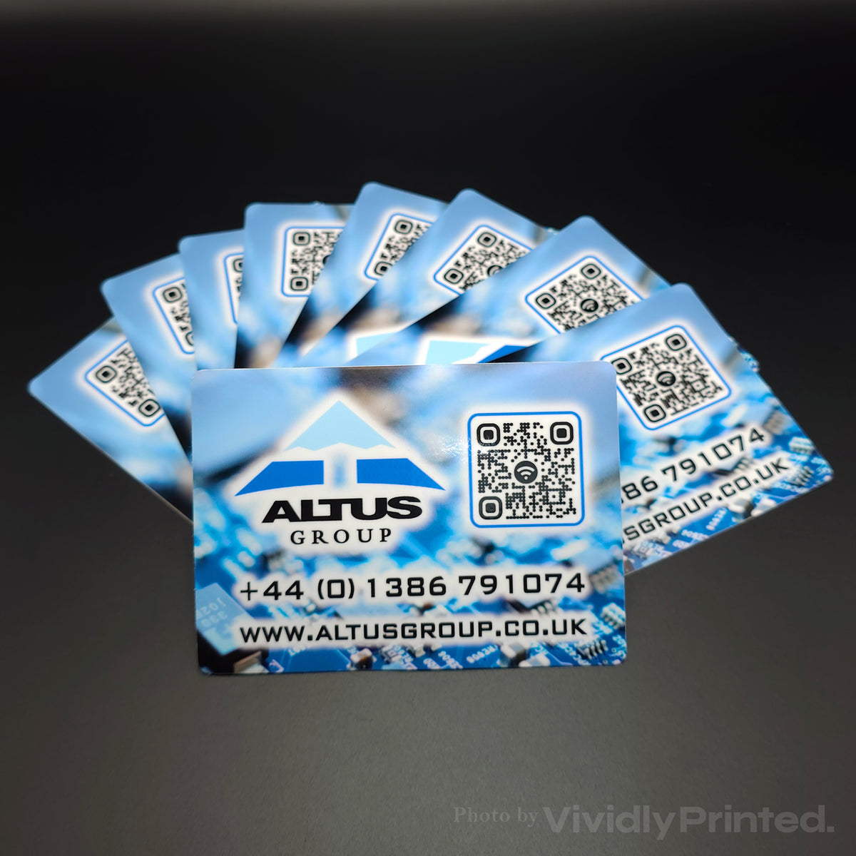 Blue Altus Group business stickers with contact details and a QR code