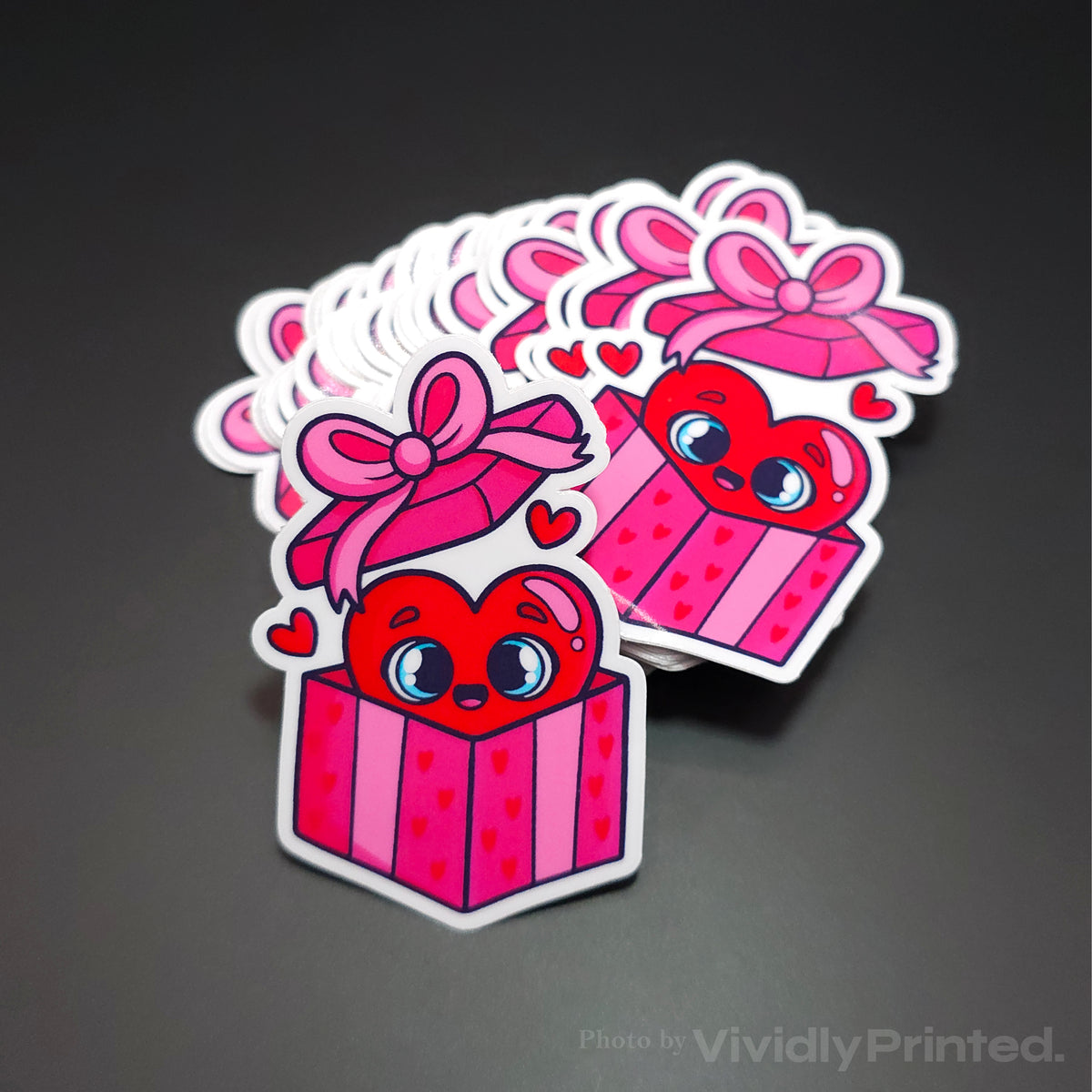 Die-cut pink gift box stickers with hearts and bows