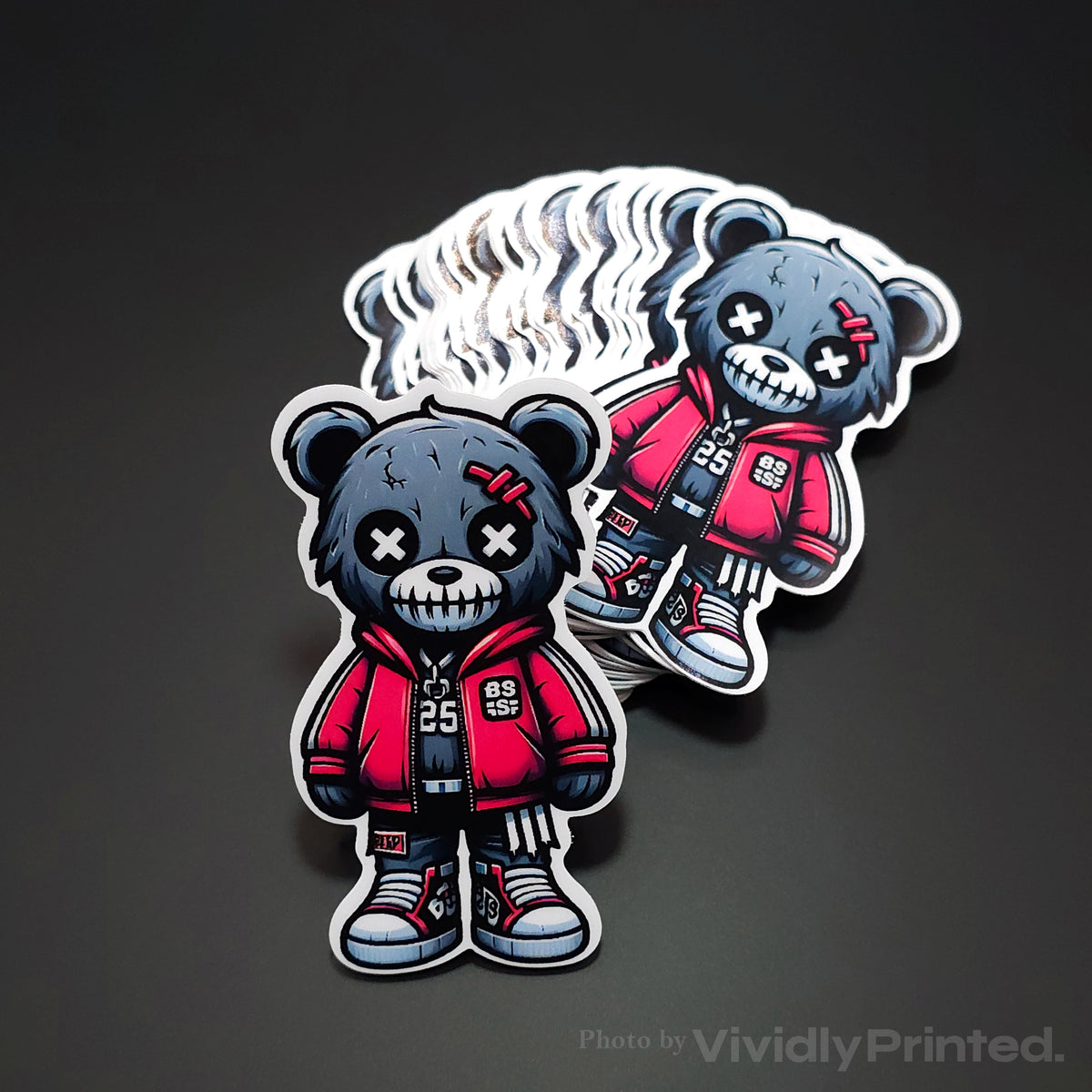 Die-cut teddy bear stickers with a red jacket and white borders