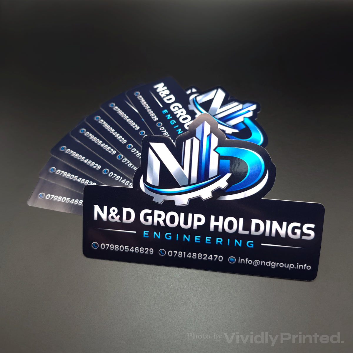 N&D Group Holdings business card stickers with contact details