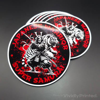 Round stickers with a red, black and white samurai warrior design