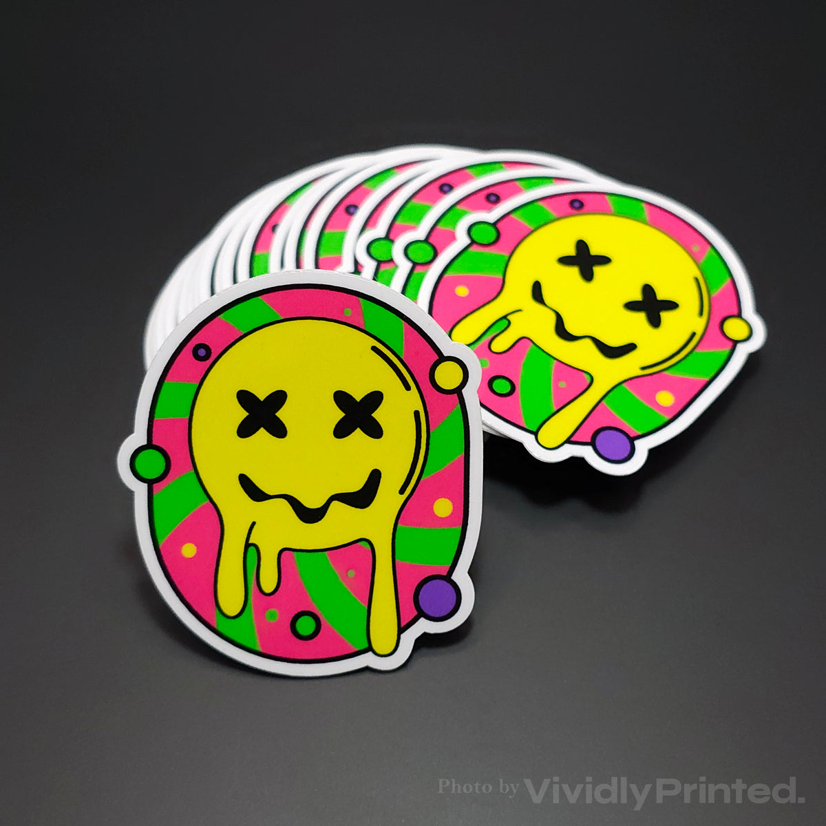Die-cut stickers with a melting yellow smiley face design