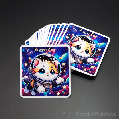 Square stickers with an Astro Cat illustration and white borders